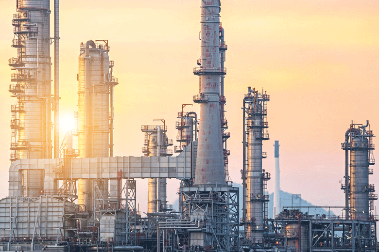 Polypropylene production plant with industrial towers at sunset